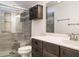 Bathroom featuring a shower with glass doors, a toilet, and a vanity at 3958 Buckhorn Rd, Sanford, NC 27330