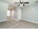 Bedroom with carpet, a ceiling fan, bright window showing natural light, and base trim at 3958 Buckhorn Rd, Sanford, NC 27330