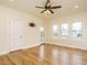 Bright bedroom with hardwood floors, a ceiling fan, and bright windows showing natural light at 3958 Buckhorn Rd, Sanford, NC 27330