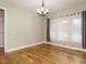 Bright dining room featuring a modern chandelier and ample natural light, creating an inviting space at 3958 Buckhorn Rd, Sanford, NC 27330