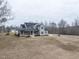 Two-story home with solar panels, a front porch, and a large yard at 3958 Buckhorn Rd, Sanford, NC 27330