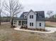 Charming two-story home with a covered front porch and solar panels at 3958 Buckhorn Rd, Sanford, NC 27330