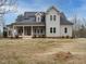 Charming home with solar panels, covered porch, and a well-manicured lawn at 3958 Buckhorn Rd, Sanford, NC 27330