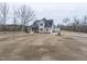 Two-story home with solar panels, a front porch, and a large yard at 3958 Buckhorn Rd, Sanford, NC 27330