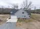 Modern two-story home featuring gray siding, a two-car garage, and a spacious yard at 3958 Buckhorn Rd, Sanford, NC 27330