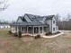 Lovely home boasts a wrap-around porch, solar panels and well-manicured landscaping at 3958 Buckhorn Rd, Sanford, NC 27330