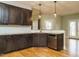 Well-appointed kitchen featuring modern appliances, dark cabinetry, and beautiful countertops, ready for culinary adventures at 3958 Buckhorn Rd, Sanford, NC 27330