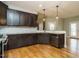 Stylish kitchen featuring granite countertops, dark cabinets, and modern appliances, creating a chef's dream at 3958 Buckhorn Rd, Sanford, NC 27330