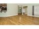 Open-concept living room featuring wood floors and a seamless flow into the kitchen at 3958 Buckhorn Rd, Sanford, NC 27330
