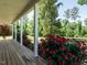 Wide porch featuring white columns with a view of the landscaped yard at 3958 Buckhorn Rd, Sanford, NC 27330
