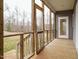This spacious screened porch offers an inviting transition to the outdoors at 3958 Buckhorn Rd, Sanford, NC 27330