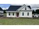 Charming, new construction home with a covered porch and white siding, awaiting its finishing touches at 3963 Baileys Xrds Rd, Benson, NC 27504