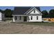Charming new construction home with classic white siding and a covered front porch at 3963 Baileys Xrds Rd, Benson, NC 27504