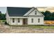 Newly constructed one-story home showcasing a classic exterior design with covered porch and charming curb appeal at 3963 Baileys Xrds Rd, Benson, NC 27504