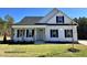Charming one-story home with white siding, black shutters, covered porch, and well-maintained lawn at 3963 Baileys Xrds Rd, Benson, NC 27504
