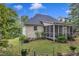 Exterior shot of the backyard showcasing the home's screened porch and landscaping at 500 Creek Valley Dr, Fuquay Varina, NC 27526