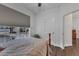 Bright bedroom featuring a large window with neighborhood views and hardwood floors at 500 Creek Valley Dr, Fuquay Varina, NC 27526
