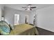 Comfortable bedroom with ensuite bathroom and walk-in closet featuring neutral paint and a ceiling fan at 500 Creek Valley Dr, Fuquay Varina, NC 27526
