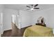 Well-lit bedroom showcasing hardwood floors, neutral walls, and a vanity table with a round mirror at 500 Creek Valley Dr, Fuquay Varina, NC 27526