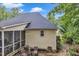 Side view of the home showcasing the screened porch, exterior siding and well-maintained roof at 500 Creek Valley Dr, Fuquay Varina, NC 27526