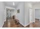 Inviting hallway leads to the living area with hardwood floors and neutral paint at 500 Creek Valley Dr, Fuquay Varina, NC 27526