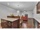 Modern kitchen with granite countertops that opens to living room with hardwood floors and white trim at 500 Creek Valley Dr, Fuquay Varina, NC 27526