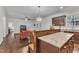 Open-concept kitchen featuring granite counters, cherry wood cabinets, and stainless steel appliances at 500 Creek Valley Dr, Fuquay Varina, NC 27526