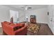 Open-concept living room with hardwood floors, ceiling fan, and lots of natural light at 500 Creek Valley Dr, Fuquay Varina, NC 27526