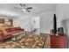 Spacious living room featuring neutral walls, hardwood floors, and natural light with a view to the kitchen at 500 Creek Valley Dr, Fuquay Varina, NC 27526
