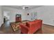 Open-concept living room featuring hardwood floors and direct access to the backyard at 500 Creek Valley Dr, Fuquay Varina, NC 27526