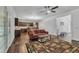 Inviting living room featuring dark hardwood floors, a decorative rug, and an open concept kitchen view at 500 Creek Valley Dr, Fuquay Varina, NC 27526