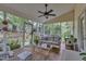 Cozy screened-in porch with wicker furniture and views of the landscaped backyard at 500 Creek Valley Dr, Fuquay Varina, NC 27526