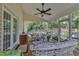 Spacious screened porch with ceiling fan and views of the well-manicured backyard at 500 Creek Valley Dr, Fuquay Varina, NC 27526