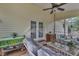 Relaxing screened porch with comfortable seating and view of the lush backyard landscaping at 500 Creek Valley Dr, Fuquay Varina, NC 27526