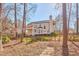 Secluded backyard featuring a covered patio, deck, and wooden fence for privacy at 5460 Ingate Way, Raleigh, NC 27613