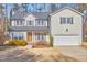 Charming two-story home with attached two-car garage and well-manicured front yard at 5460 Ingate Way, Raleigh, NC 27613