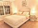 Comfortable bedroom features a queen size bed and a window with curtains at 5841 Wynmore Rd, Raleigh, NC 27610