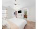 Bright bedroom features a ceiling fan and includes ensuite bathroom access and outdoor balcony access at 5841 Wynmore Rd, Raleigh, NC 27610