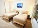 Comfortable bedroom features twin beds, a window, and simple decor at 5841 Wynmore Rd, Raleigh, NC 27610