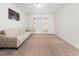 Spacious bedroom with carpet, a comfortable sofa, and a picture window at 5841 Wynmore Rd, Raleigh, NC 27610
