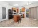 Well-equipped kitchen with wood cabinetry, granite countertops, and stainless steel appliances at 5841 Wynmore Rd, Raleigh, NC 27610
