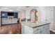 Open kitchen with an island and seamless flow into living space at 5976 Jones Farm Rd, Wake Forest, NC 27587