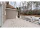 View of the back deck with a hot tub surrounded by a decorative white railing at 6016 Heatherstone Dr, Raleigh, NC 27606