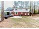 Spacious backyard featuring a patio, red brick exterior and a sunroom perfect for outdoor entertaining at 612 W Chisholm St, Sanford, NC 27330