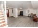 Partially finished basement area with wood flooring and staircase at 612 W Chisholm St, Sanford, NC 27330