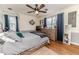 Cozy bedroom with hardwood floors, natural light, and stylish decor, creating a warm and inviting space at 612 W Chisholm St, Sanford, NC 27330