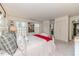 Comfortable bedroom features soft carpet, a decorative bedframe, and lots of natural light at 612 W Chisholm St, Sanford, NC 27330
