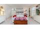 Cozy bedroom featuring a decorative bedframe, built-in shelving, and soft carpet at 612 W Chisholm St, Sanford, NC 27330
