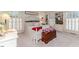 Bright bedroom with built-in bookcases, soft carpet, and a comfortable bed at 612 W Chisholm St, Sanford, NC 27330