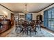 Inviting dining room showcasing hardwood floors, chandelier, and backyard view at 612 W Chisholm St, Sanford, NC 27330